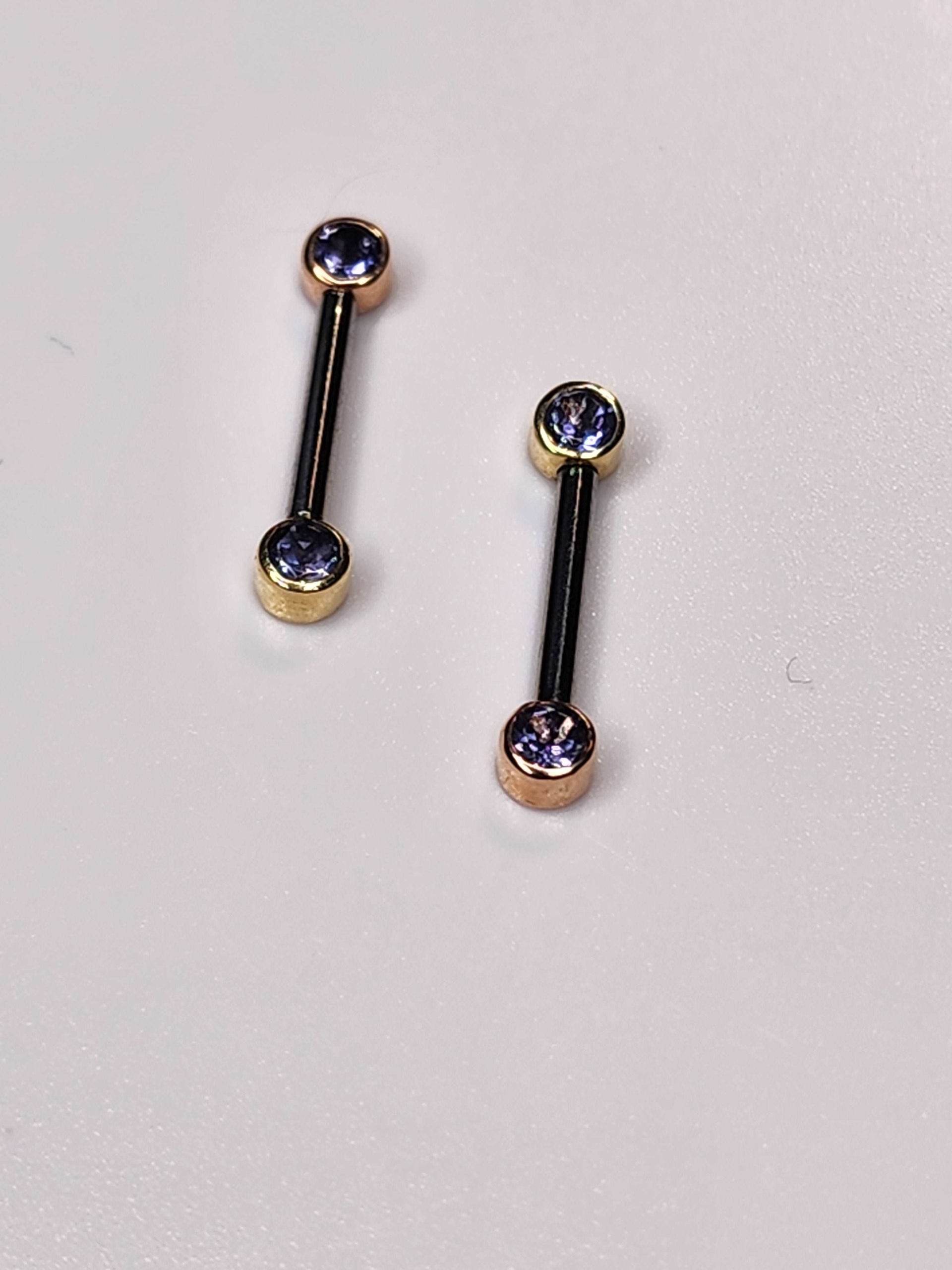 solid 14kt yellow and rose gold threadless side facing tops with genuine iolite stones in a bezel setting