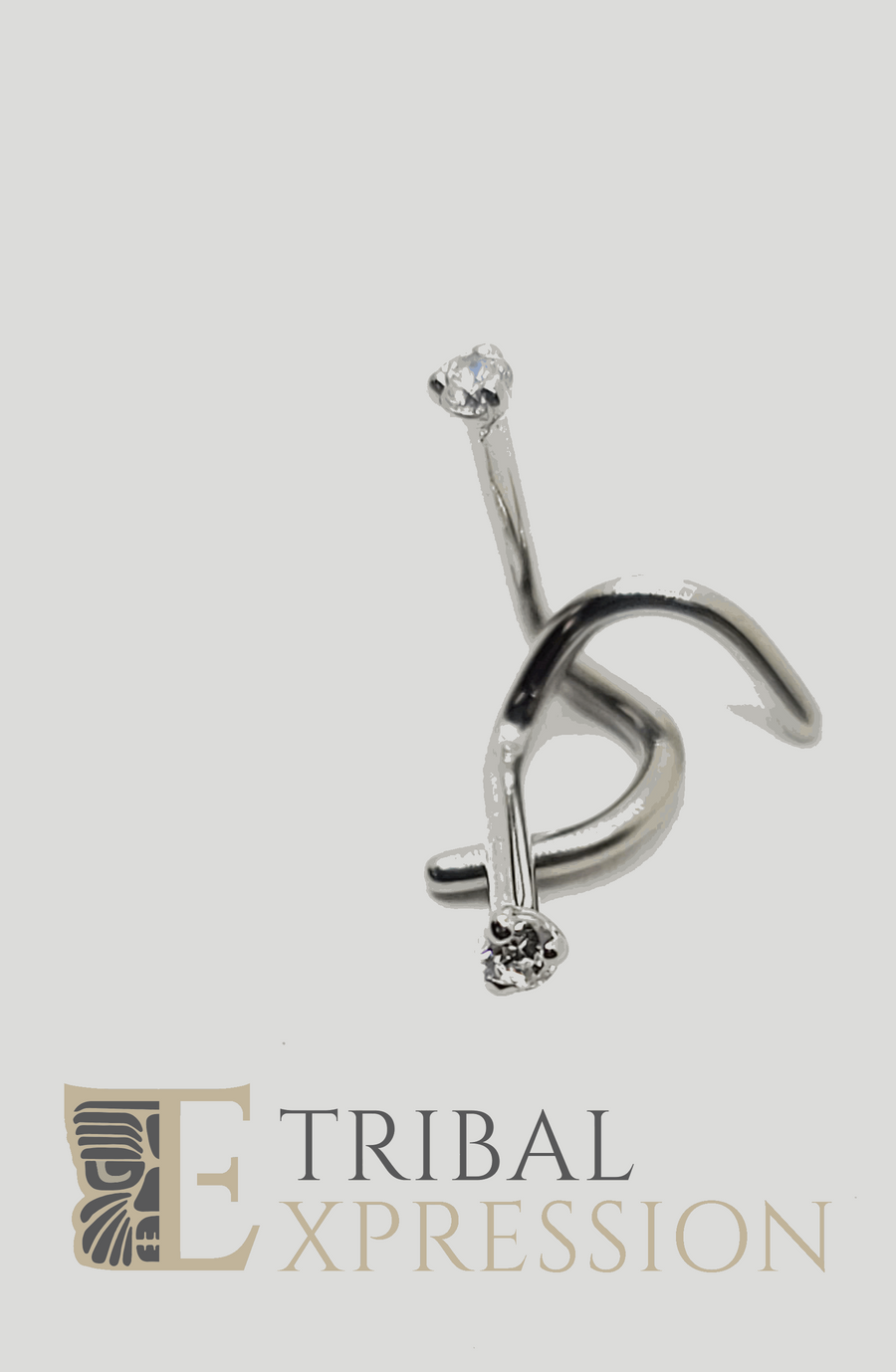 Bent titanium nostril screw with a clear three-prong gemstone setting