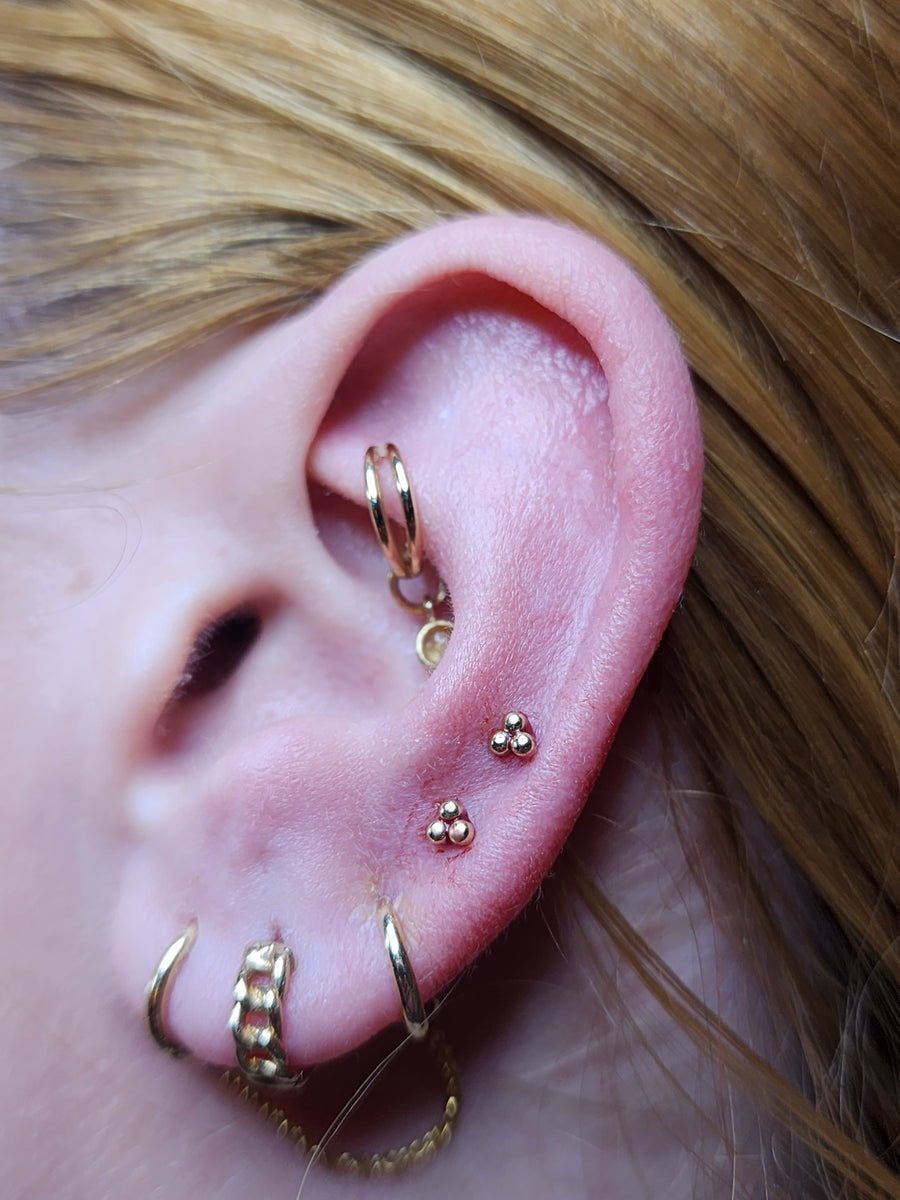 Ear styling with bead clusters, small hoops and a fine chain