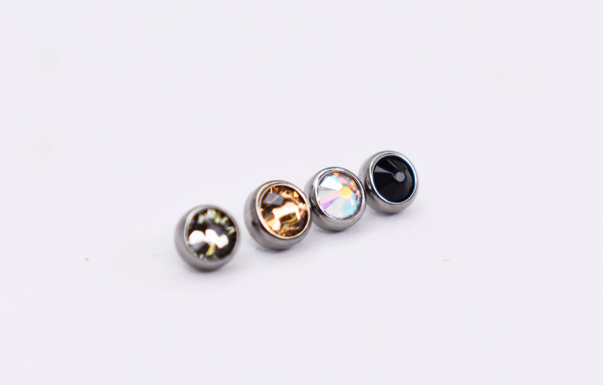 Titanium bezel set Cubic Zirconias. 16g 3mm Smoke, Greig, Aurora Borealis, Black gems.