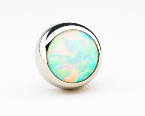 Our titanium threadless white synthetic opal picks up some of the most beautiful blue undertones